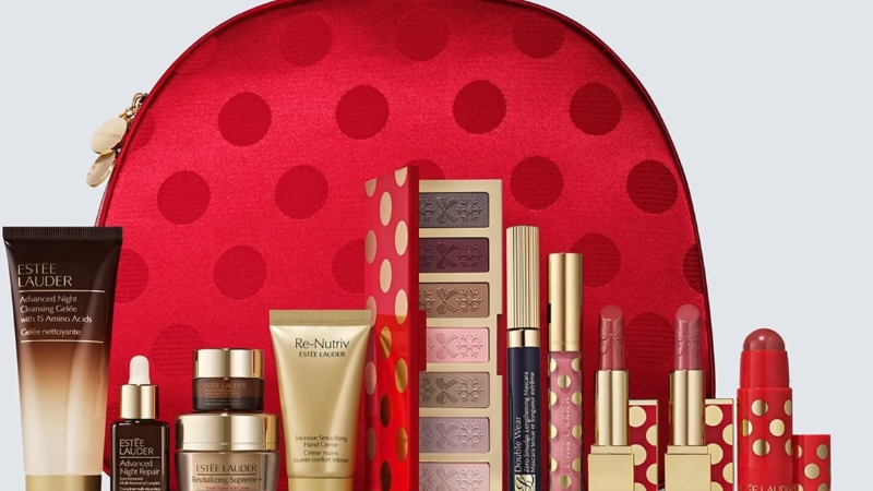 Estee Lauder set kozmetike sa crvenim neseserom na tufne, kremama, serumom, senkama i ruževima